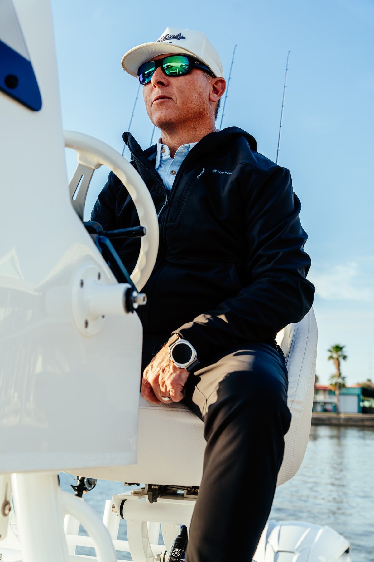 Men's Windward Thermal Hoody in Black, seated on the tower
