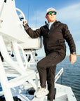 Men's Windward Thermal Hoody and Pant in Black on the boat