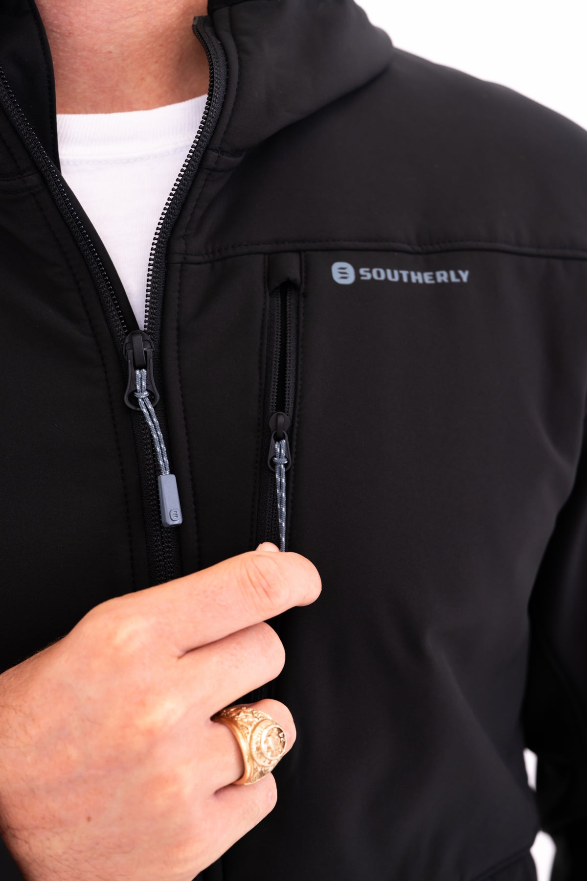 Windward Thermal Hoody in Black — zippered chest pocket and logo detail